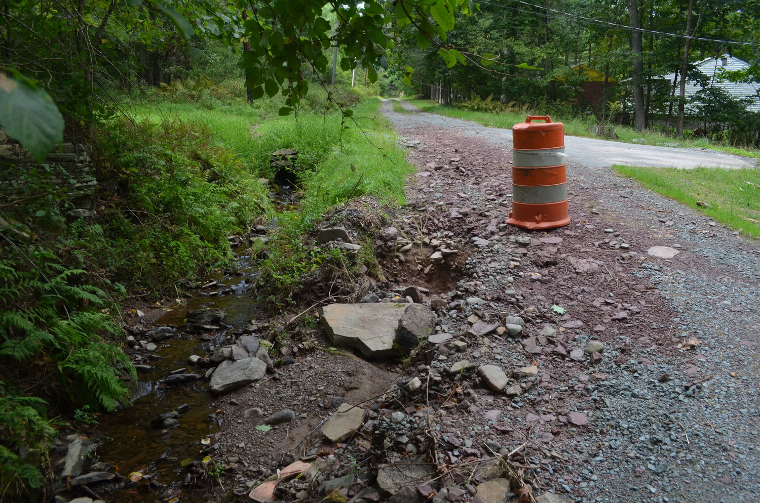 The damage caused by Hurricane Ida to Luxton Lake's roads.